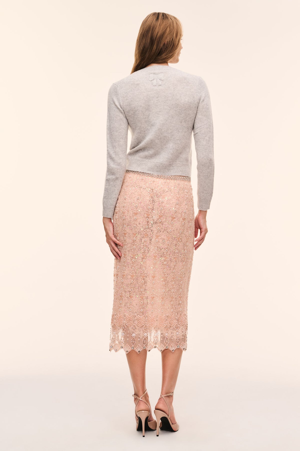 Back view of rose-gold beaded midi skirt with lace scallop hem