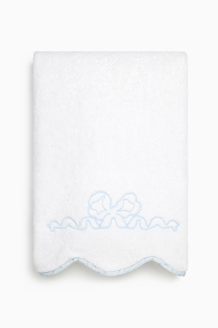 White bath towel with light-blue bow embroidery and scalloped bottom edge