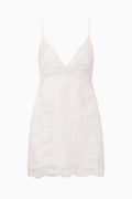 Eyelet linen mini dress in optic white with spaghetti straps and scalloped hem