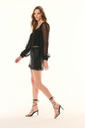 Black slip mini skirt with lace bottom hem in side view