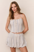 Cotton mini bubble skirt in light blue vertical stripes with cinched waist and flared shape