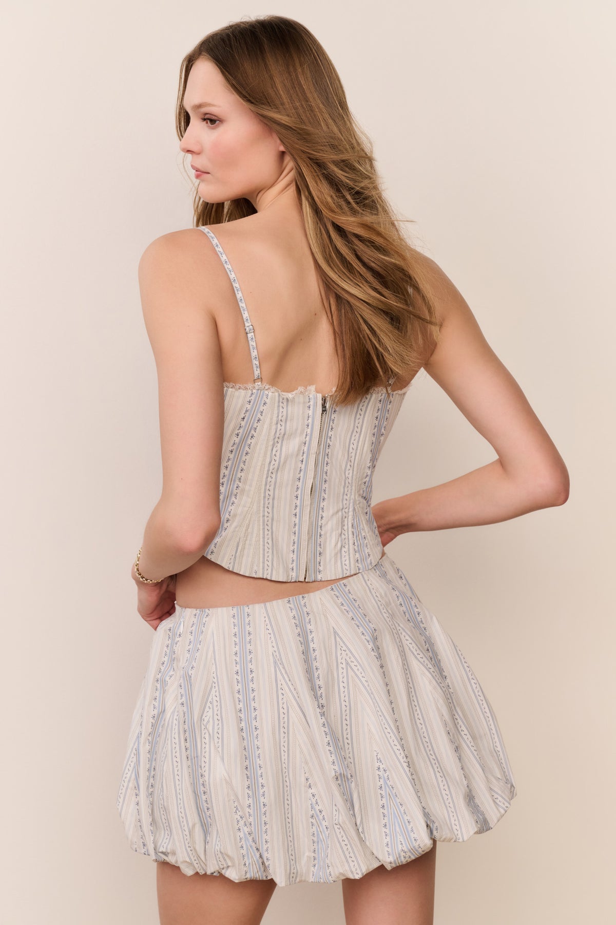 Mini bubble skirt in light blue striped cotton, gathered at waist and flared hem