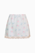 Blue mini satin slip skirt with pink and blue floral print and lace hem trim