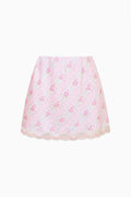 Pink mini satin slip skirt with allover floral print and scalloped lace hem