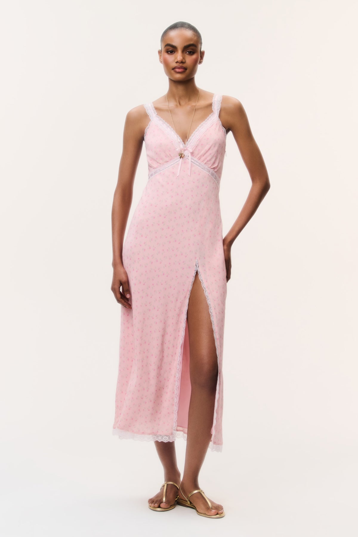 Pink floral maxi dress with V-neckline, spaghetti straps, front button detail, slit