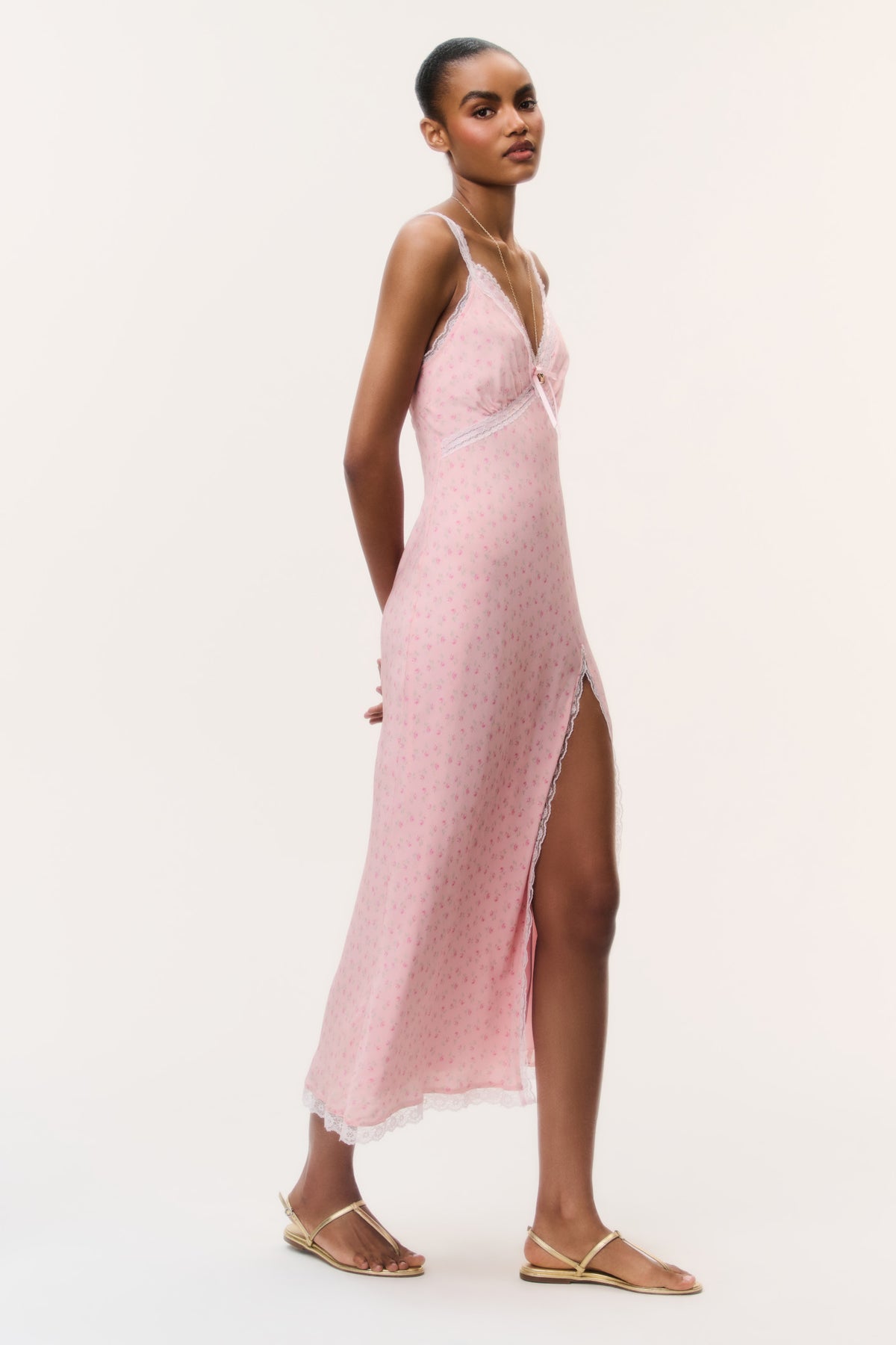 Pink floral maxi dress with V-neck and spaghetti straps, long side slit, lace edge