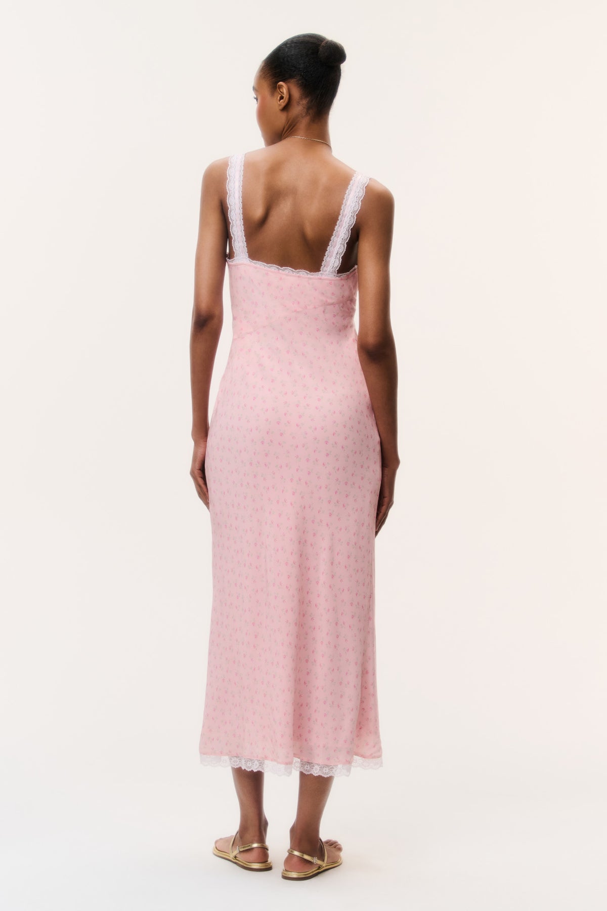 Pink floral maxi dress back view with lace-trim straps and fitted open-back design