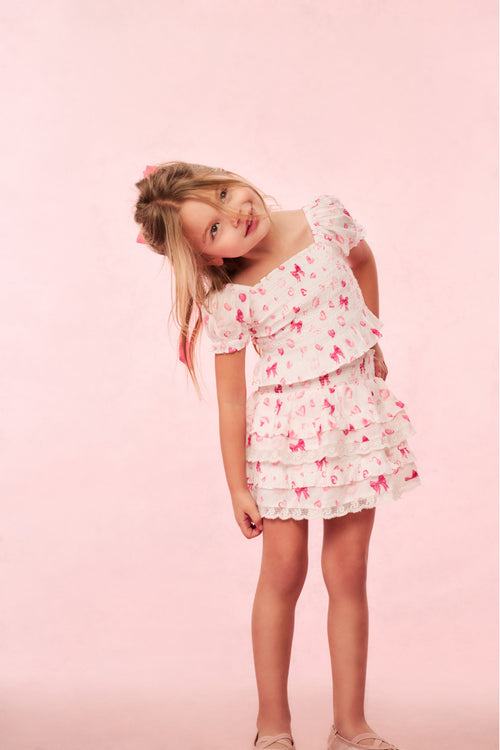 Girls pink ruffle tier skirt with heart and kiss print