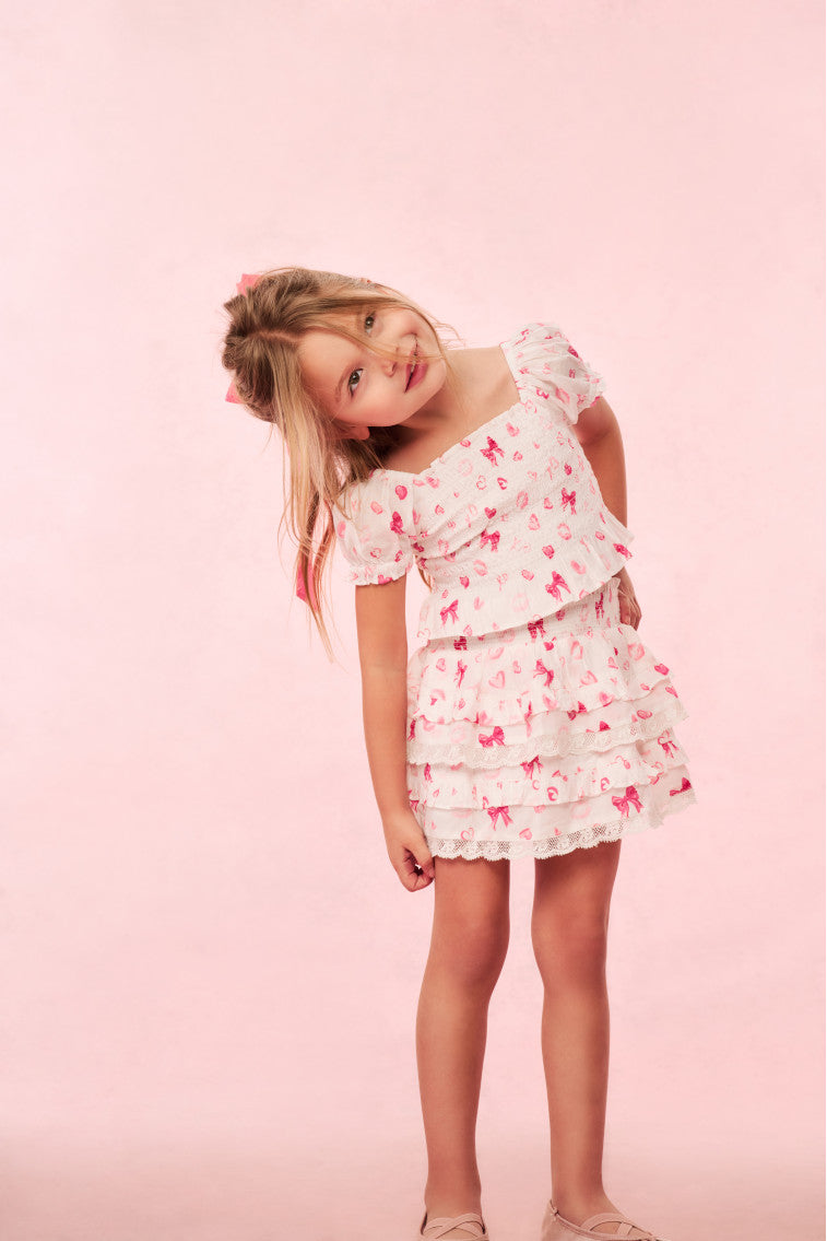 Girls pink ruffle tier skirt with heart and kiss print