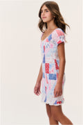 Tween patchwork mini dress, side view with puff sleeves and blue/red block design