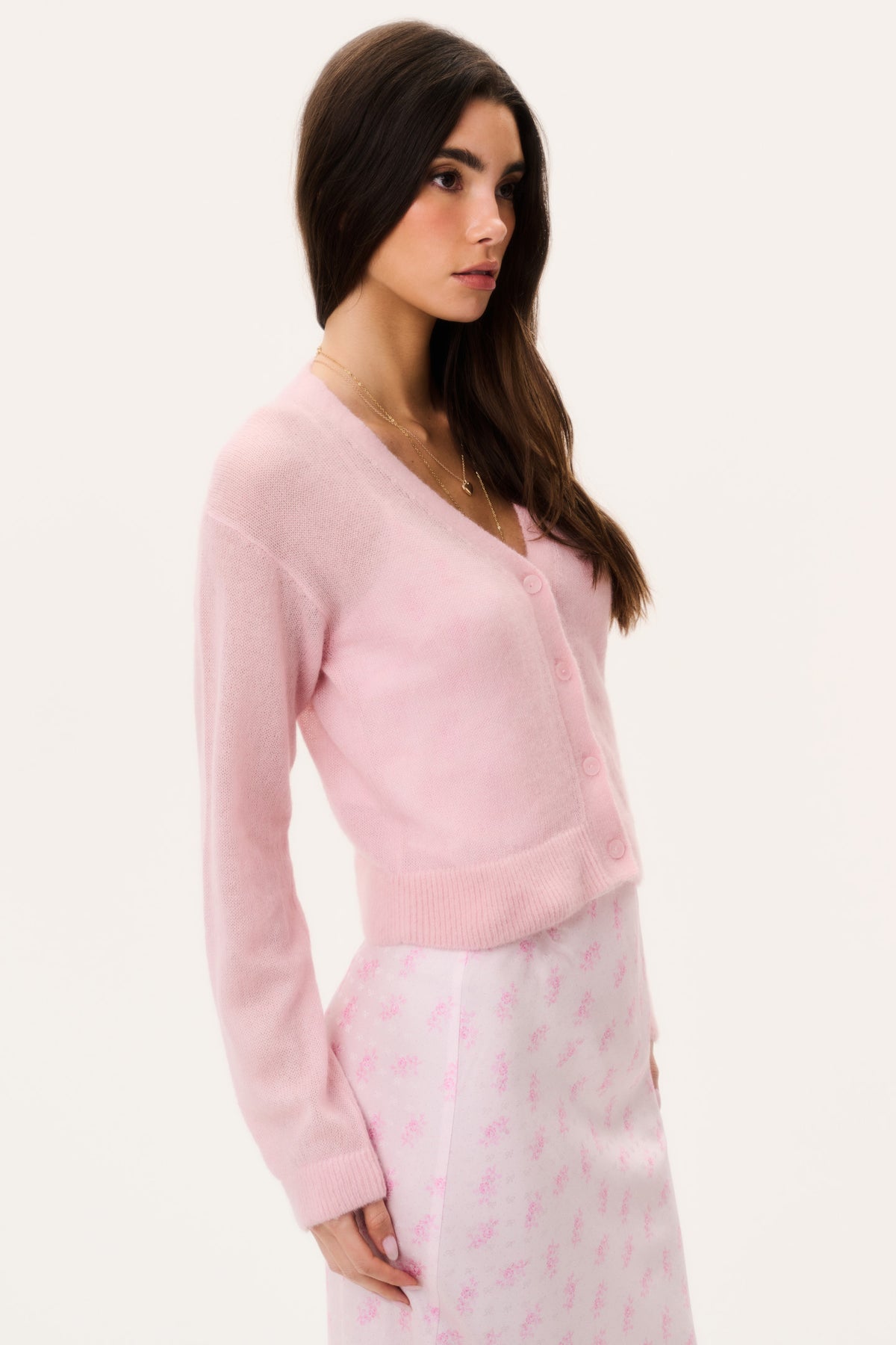 Pink sheer alpaca cardigan side view with V-neck button front