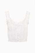White cotton sleeveless top with U-neck ruffle trim and front button placket