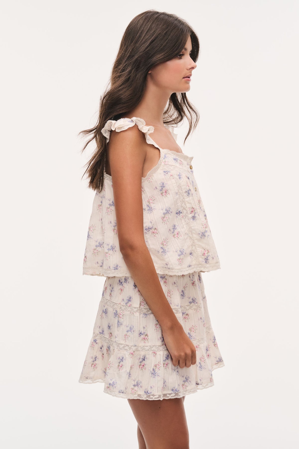 Floral cotton top with ruffled cap sleeves and tiered peplum hem