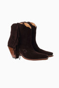 Brown suede cowboy ankle boots with fringe tassels and low wooden heel