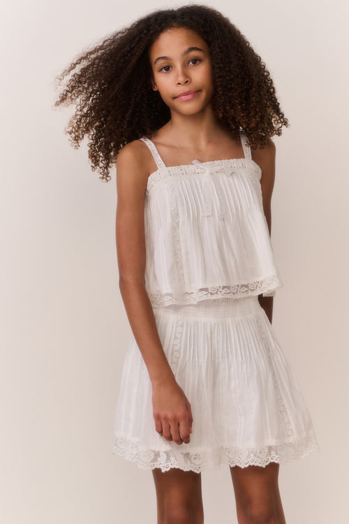 White cotton tiered skirt with elastic waist and lace hem detail, front view