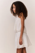 White cotton tween sleeveless top with spaghetti straps and tiered ruffle hem
