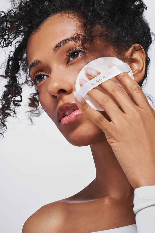 LALAIS blotting compact with white puff pad, shown during makeup touch-ups