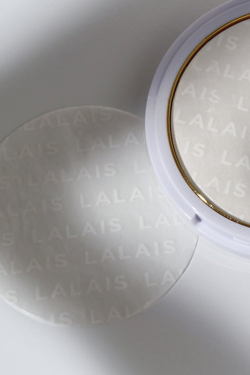 LALAIS blotting compact open, showing white blotting discs and gold-trim mirror