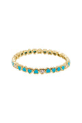Gold tone heart stretch bracelet with blue heart and clear accents