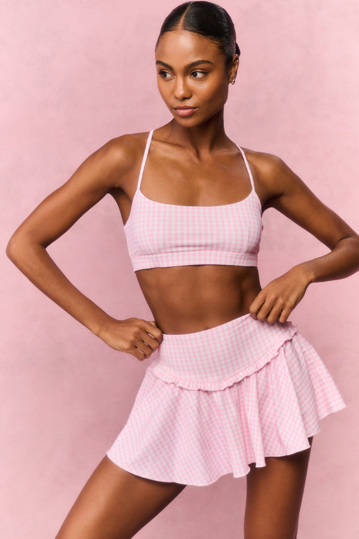 Pink gingham active skort with flared tiered ruffles and elastic waistband