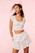 Cotton floral crop top with short puff sleeves and scalloped neckline