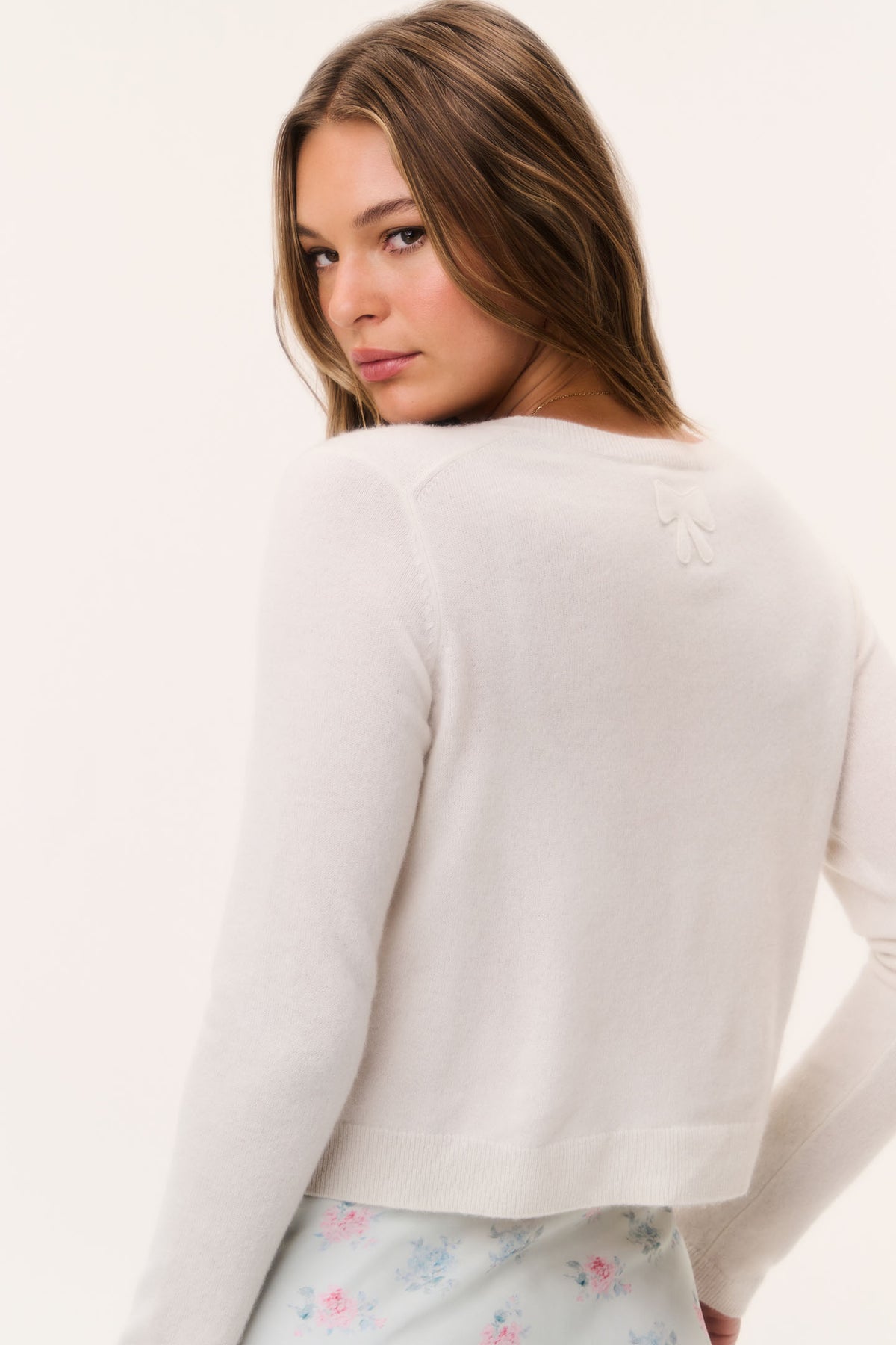 Lightweight cashmere cardigan in diamond white, back bow detail, long sleeves
