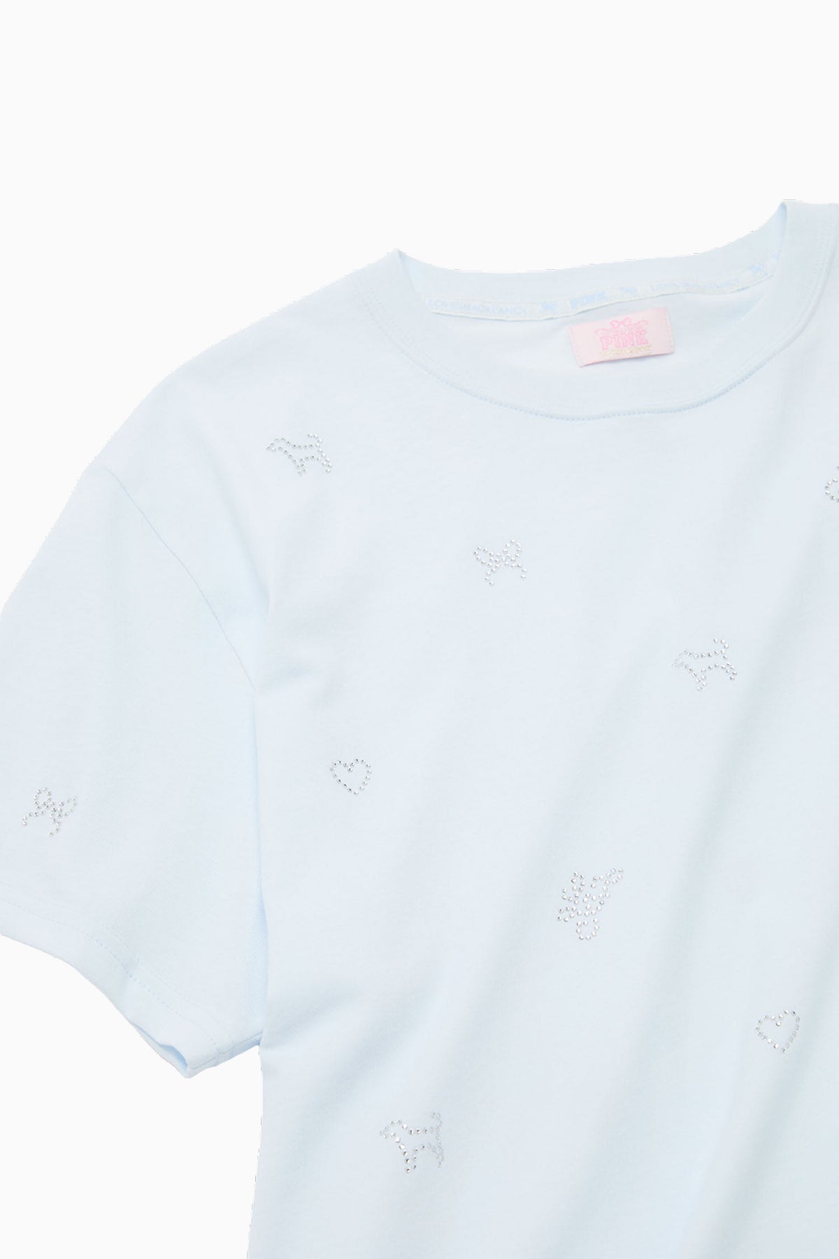Light blue cotton tee with small embroidered-style heart and icon details