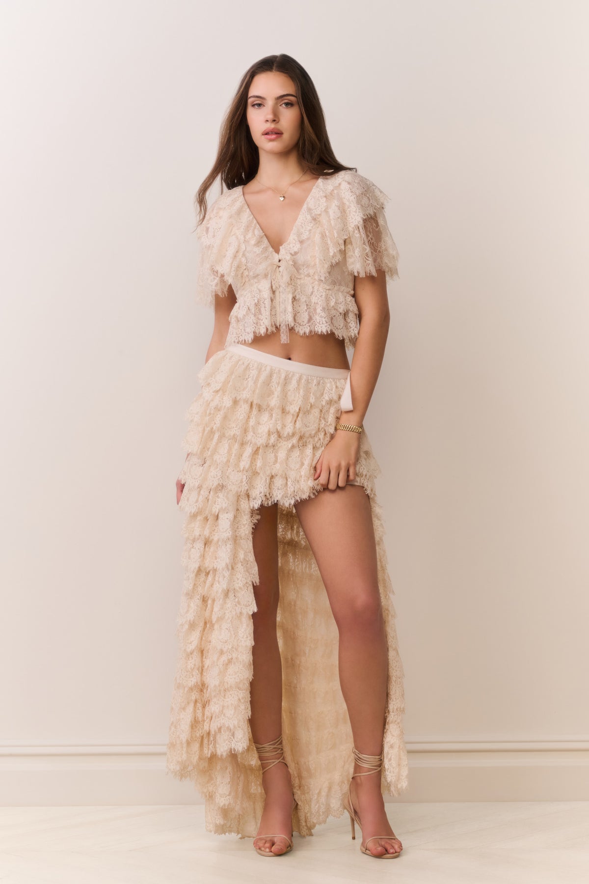 Ivory lace ruffle high-low skirt with layered ruffle tiers and scalloped hem