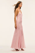 Light pink maxi dress angled side view with spaghetti straps, V-neck, and patterned fabric.