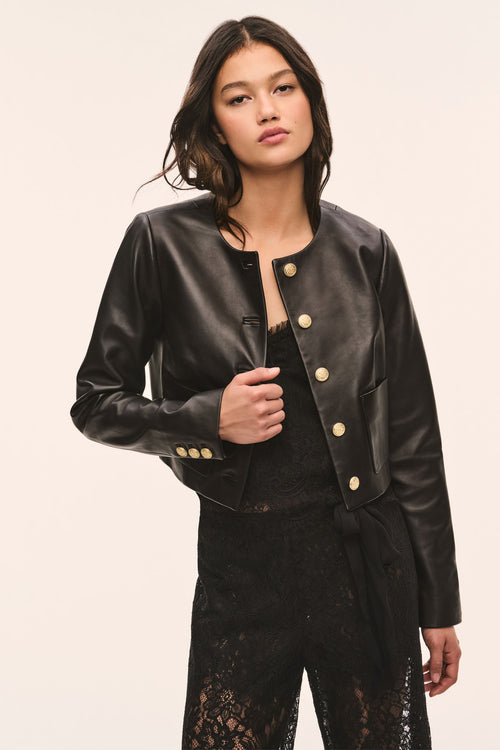 Black collarless leather jacket with gold snap button placket and two front pockets