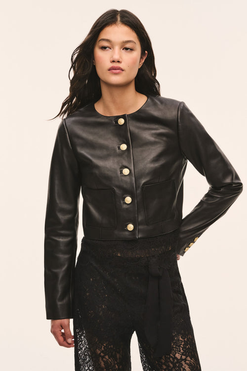 Black collarless leather jacket with gold snap buttons and lace detail at the waist