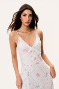 Silk maxi dress bodice with V-neck and cross-drape straps, pastel floral pattern