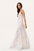 Silk maxi dress side view with spaghetti straps and pastel floral patchwork print