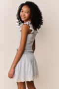 Ivory floral cotton skirt with lace-trim ruffle hem and gathered tiered panels, side