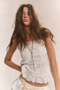 Cotton cami top in bright white with embroidered texture, lace neckline, and straps.