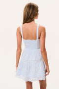Light blue cotton mini dress back view with thin straps and tiered ruffle skirt, lace trim
