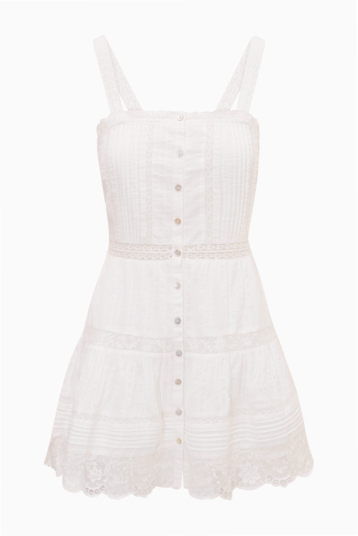 White cotton mini dress with spaghetti straps, button-front panels, tiered tiers, lace hem