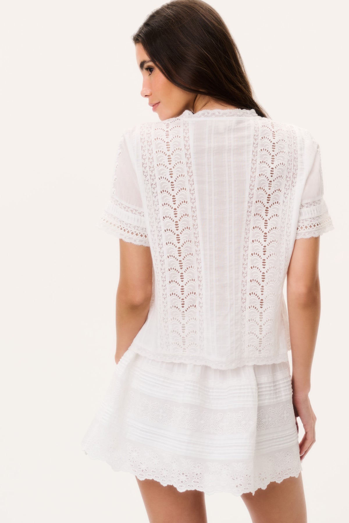 White cotton Victorian top with lace pattern on back and short sleeves
