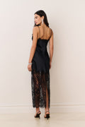 Black satin lace maxi dress viewed from the back, spaghetti straps and lace hem