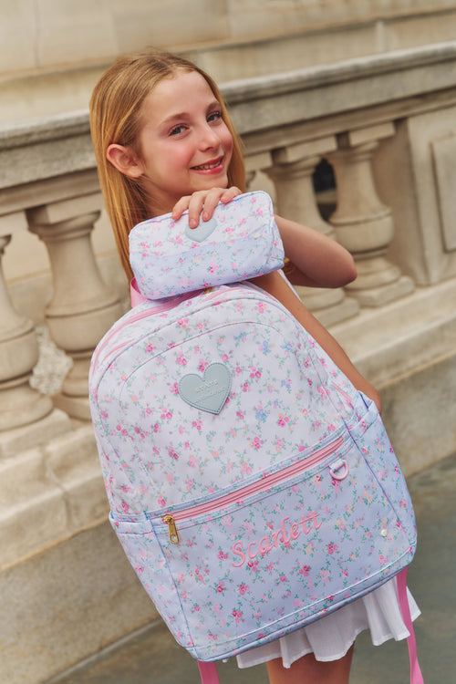 Floral backpack with heart patch, front zipper pocket, pink straps