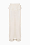 Cream silk lace-trimmed balloon pants with ruffled cuffs and elastic waistband