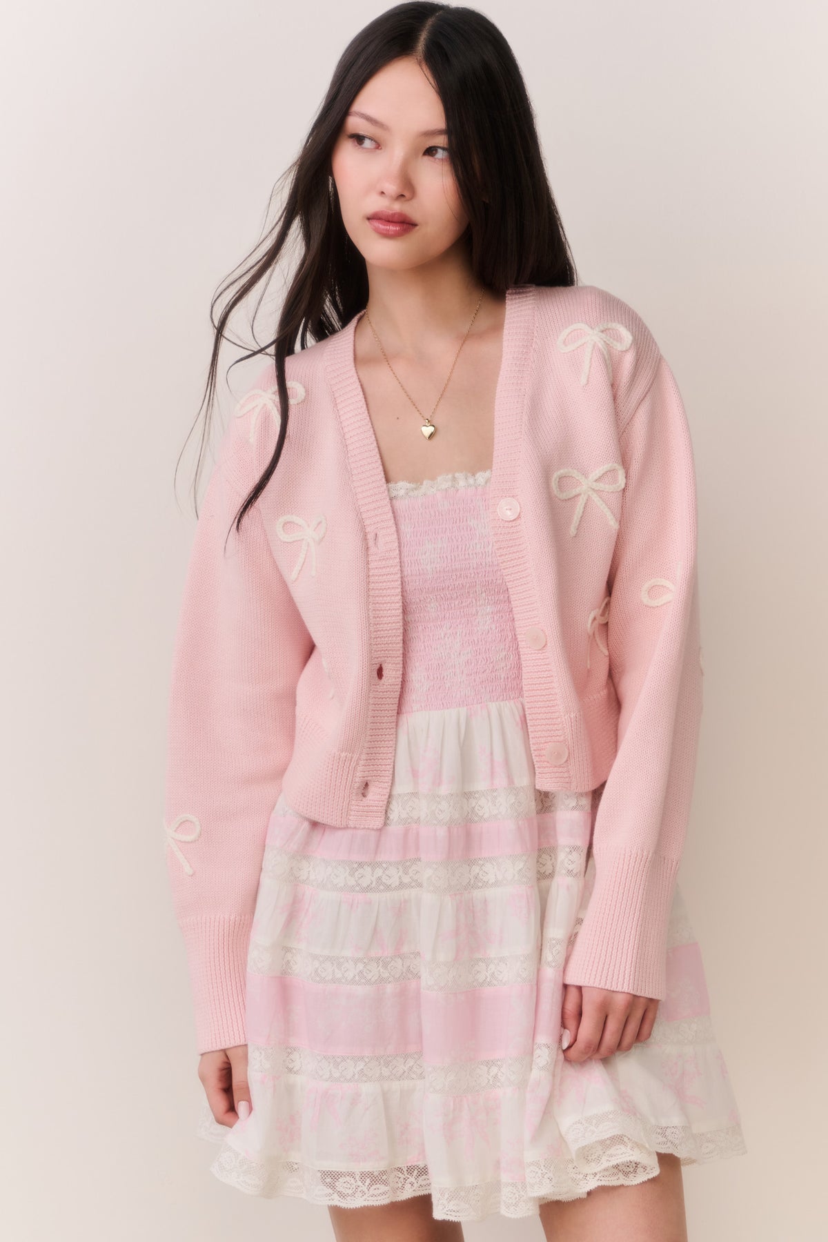 Petal pink button-front cardigan with bow embroidery and V-neck