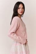 Petal pink cardigan with bow embroidery on sleeves and ribbed cuffs