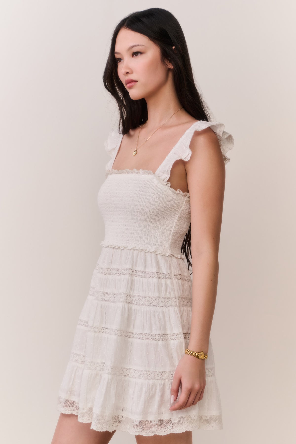 Side-view lace-trimmed cotton mini dress in pale white, square neck, ruffle straps