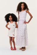 Kids tiered skirt with red cherry print, elastic waist, and layered ruffle hem