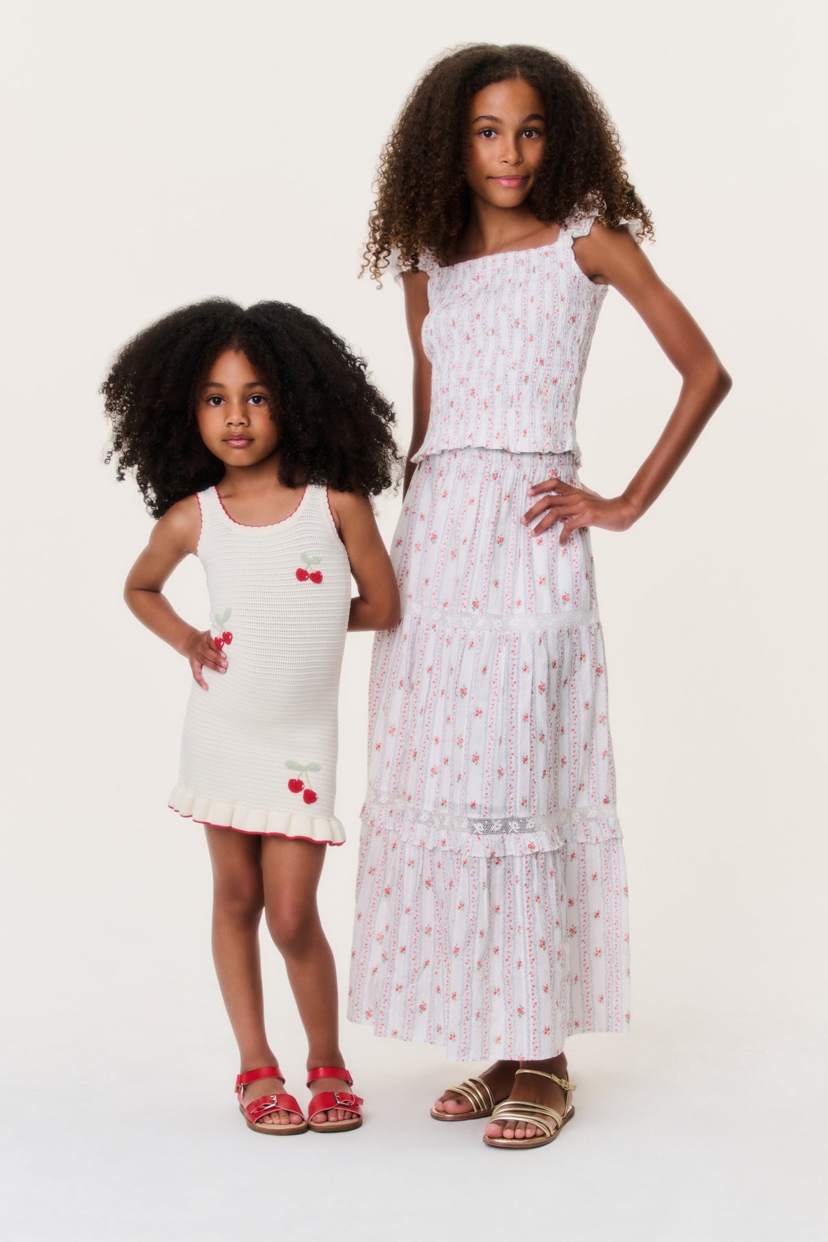 Kids tiered skirt with red cherry print, elastic waist, and layered ruffle hem