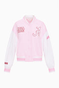Folded light pink varsity jacket with button front and embroidered team “A” graphic