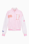 Light pink varsity jacket with button front, ribbed trim, and collegiate T patch