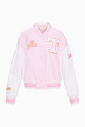 Front view of pink varsity jacket with snap buttons, striped rib trim, and T applique