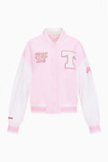 Light pink varsity jacket with button front, ribbed trim, and Hook 'Em patch
